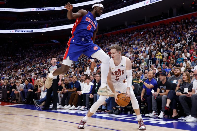 Cavaliers guard Sam Merrill is defended by Pistons guard Caris LeVert in the first half during Game 7 of the second round of the NBA playoffs, May 17, 2026 in Detroit.