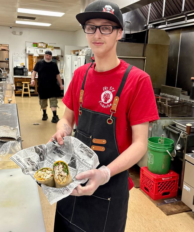 One of Keagen Leigh's favorite items to make at the Coshocton Elks Lodge is a chicken wrap. He hopes to pursue culinary school and is grateful to those at the Coshocton Opportunity School who helped him find a new direction as well as this job.