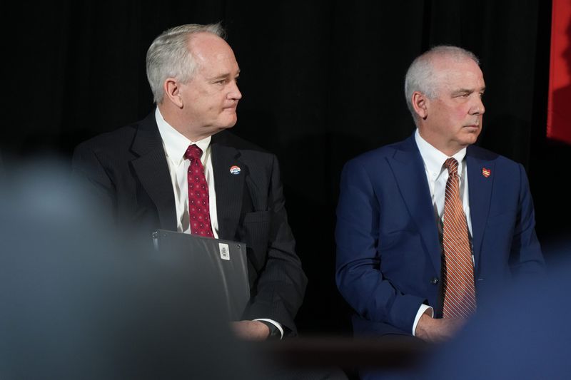 Keith Faber (left), Auditor of State, and Matt Huffman, Speaker of the Ohio House of Representatives listen as Ohio governor candidate Vivek Ramaswamy rolls out a plan to tackle Medicaid fraud in light of allegations about home healthcare issues. The news conference was held May 19, 2026 at the Westin Great Southern Hotel in downtown Columbus, Ohio.