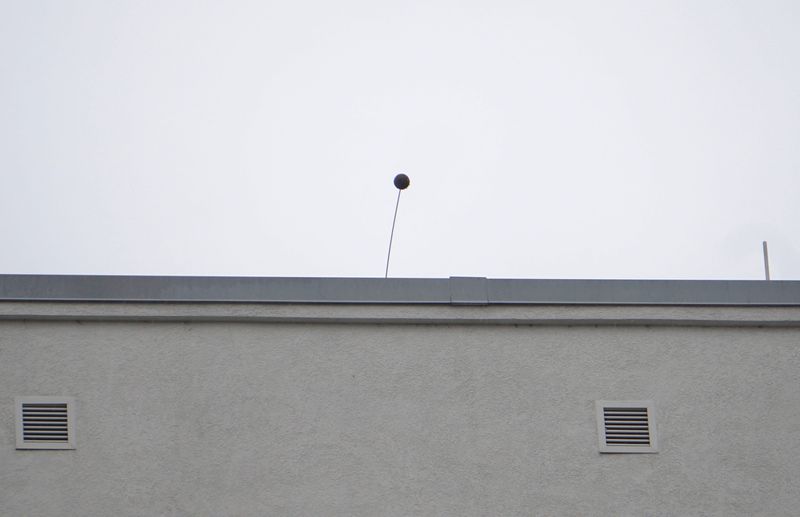 A replica baseball mounted on top of the roof the Current at The Banks apartment building is a hidden detail of the Cincinnati Reds' Tony Perez statue outside Great American Ball Park. The ball is meant to simulate Perez's pivotal home run in Game 7 of the 1975 World Series.