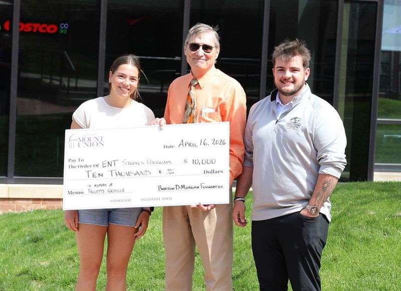 University of Mount Union Professor Mike Kachilla, center, took part in a campus event that celebrated the college receiving a grant that will help entrepreneurial students including Maddie May, left, and Ryan Beauregard, right.
