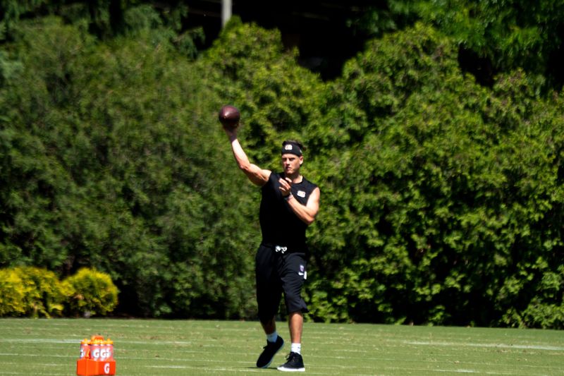 Cincinnati Bengals quarterback Joe Burrow (9) throws a pass during a practice session at the Kettering Health Practice Fields in Cincinnati on Tuesday, May 12, 2026.
