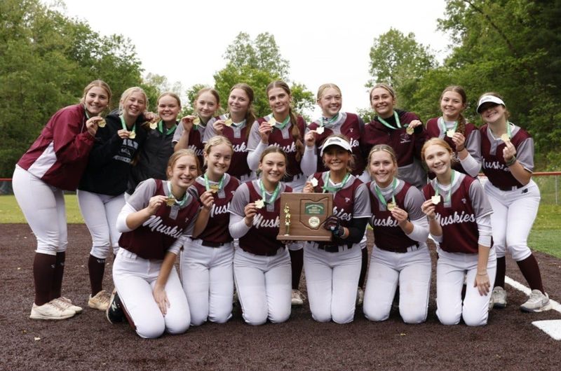 John Glenn proudly shows off their hardware after winning the Division IV district championship with a 9-0 win over top-seeded Beaver Local at Tusky Valley High School on Wednesday, May 20, 2026. The Muskies improve to 25-5 and will open play in the Division IV regional on Wednesday, May 27 at 2 p.m.