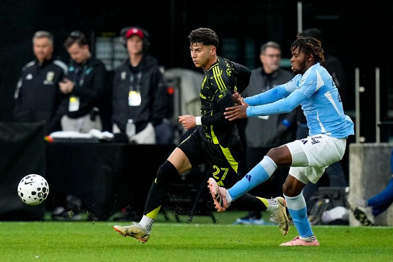 Columbus Crew midfielder Max Arfsten (27) passes the ball against New York City FC defender Tayvon Gray (24) during the U.S. Open Cup quarterfinal match at ScottsMiracle-Gro Field on Wednesday, May 20, 2026 in Columbus, Ohio.