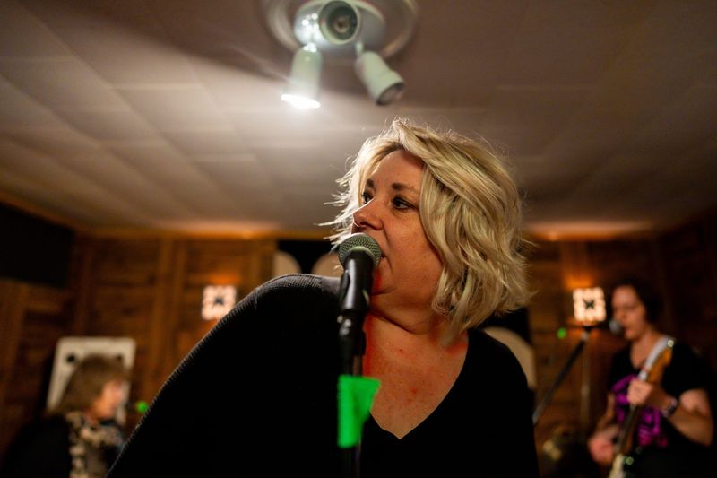 Tracey Thomas, lead vocalist of The Crones, rehearses with the band in Tallmadge.