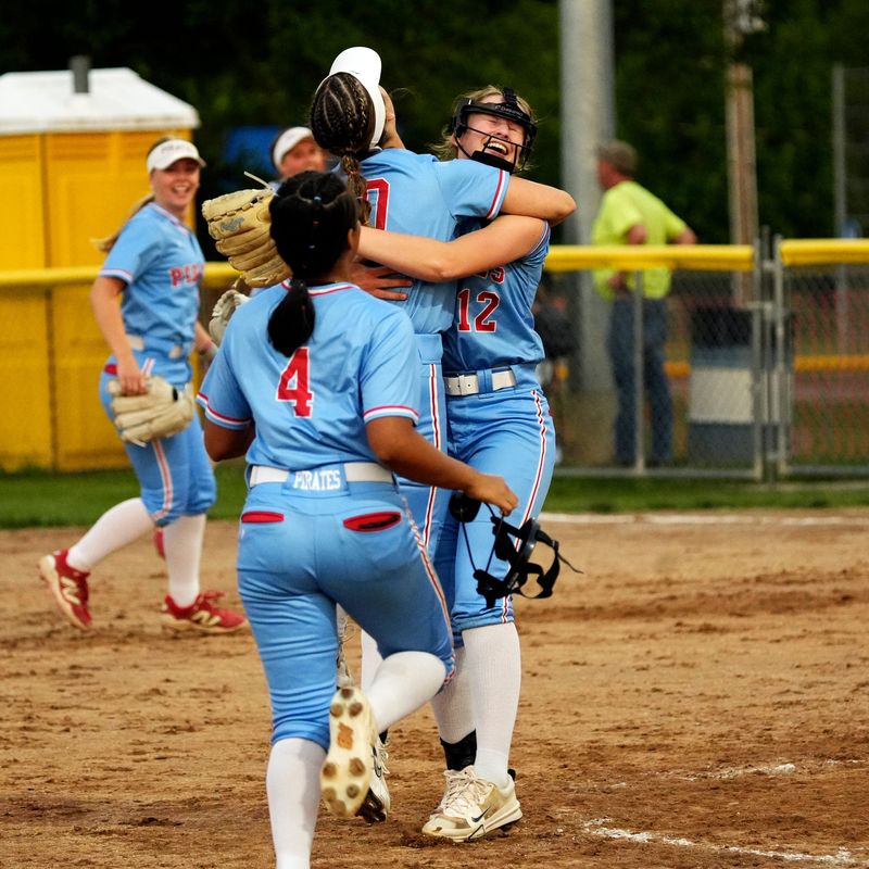 Garaway shortstop True Tango celebrates with pitcher Audrey Miller after securing the final out of a 4-0 win against Crooksville in a Division VI district final on Thursday, May 22, 2026, at Cambridge City Park in Cambridge, Ohio. Miller pitched and starter Annabelle King, who pitched five innings, combined on a six-hitter as the Pirates reached a second straight regional.
