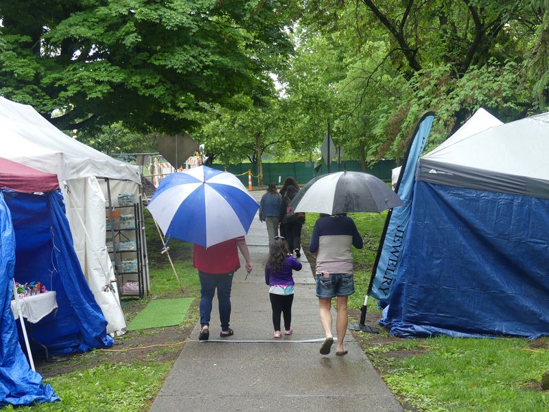 Visitors to the 2026 Feast of the Flowering Moon carried umbrellas to stay dry.