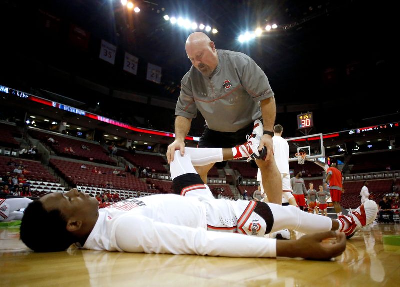 Ohio State Buckeyes center David Bell (bottom) warms up with strength coach Dave Richardson before the Dec. 3, 2016 game against the Fairleigh Dickinson Knights at Value City Arena.