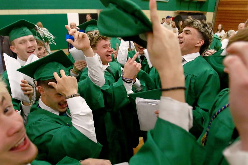 Friends celebrate after the West Branch High School Class of 2026's commencement ceremony Friday, May 22, 2026, in the school's gym.