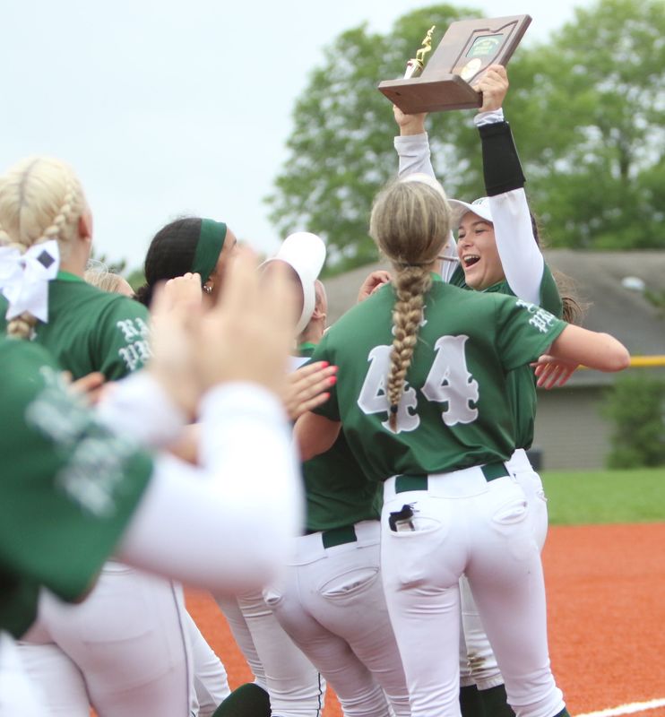 Madison's Campbell Kiser hoists up the Division III district championship trophy after the Rams' 10-2 win over Celina on Saturday, May 23, 2026.