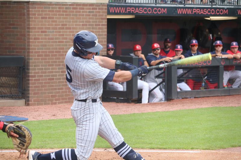 Xavier outfielder Clay Burdette (5) connects on an RBI single in the sixth inning of a Big East Tournament game against St. John's at Prasco Park in Mason, Ohio on Saturday, May 23, 2026.