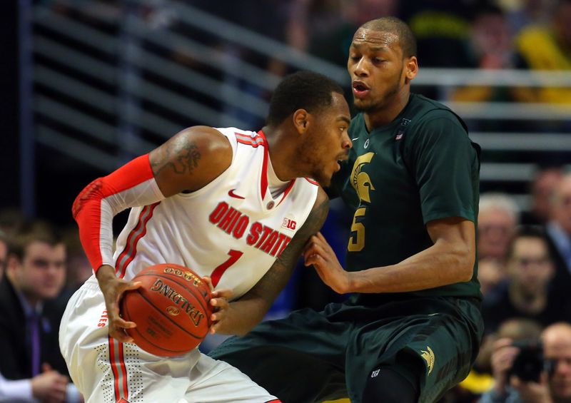 Mar 16, 2013; Chicago, IL, USA; Ohio State Buckeyes forward Deshaun Thomas (1) drives against Michigan State Spartans forward Adreian Payne (5) in the second half during the semifinals of the Big Ten tournament at the United Center. Mandatory Credit: Dennis Wierzbicki-USA TODAY Sports