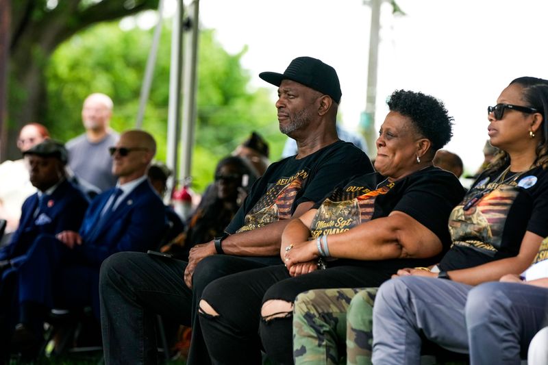 Mylo and Cheryl Simmons listen to a speaker honor their son, Master Sgt. Tyler Simmons, at a Memorial Day ceremony at the Linden War Memorial on Monday, May 25.