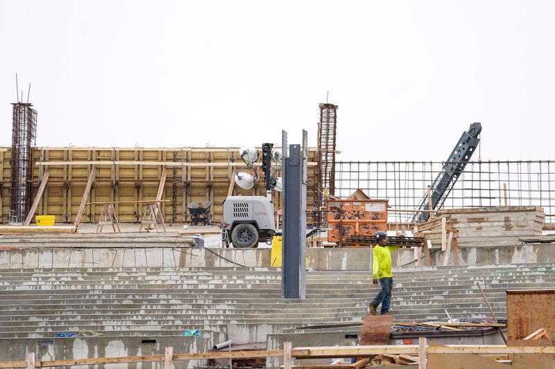 A construction worker walks across the upper seating area of the Farmer Music Center, Tuesday, May 26, 2026, in Cincinnati.