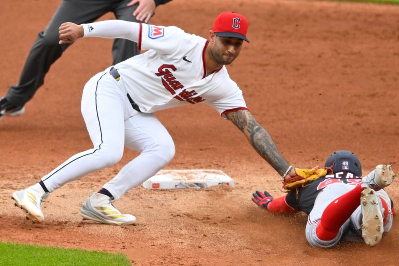 May 26, 2026; Cleveland, Ohio, USA; Washington Nationals third baseman Curtis Mead (45) is tagged out by Cleveland Guardians shortstop Brayan Rocchio (4) while attempting to steal second base in the second inning at Progressive Field. Mandatory Credit: David Richard-Imagn Images