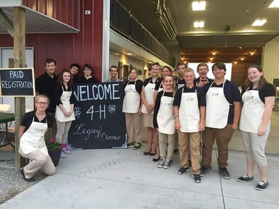 4-H youth volunteers giving back to the program by assisting at a previous Legacy Dinner.