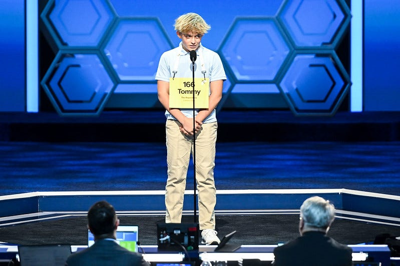 Tommy Schervish, a seventh grader from St. Michael Catholic School in Plain Township, works Tuesday, May 26, 2026, with Scripps National Spelling Bee head associate pronouncer Brian Sietsema during the first round of the bee.