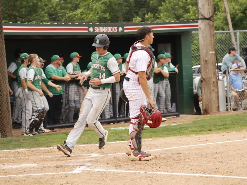 Barnesville's Blake Burkhart (14) crosses the plate to score during Division V district semifinal action versus No. 8 seed Union Local on Tuesday, May 26, 2026 at Barnesville Memorial Park. The top-seeded Shamrocks (20-7) collected a 4-1 victory to advance to Thursday's district championship game.