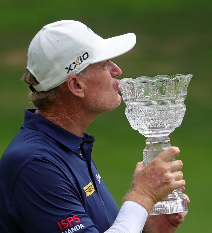 Ernie Els celebrates winning the Kaulig Companies Championship golf tournament at Firestone Country Club, Sunday, July 14, 2024, in Akron, Ohio.