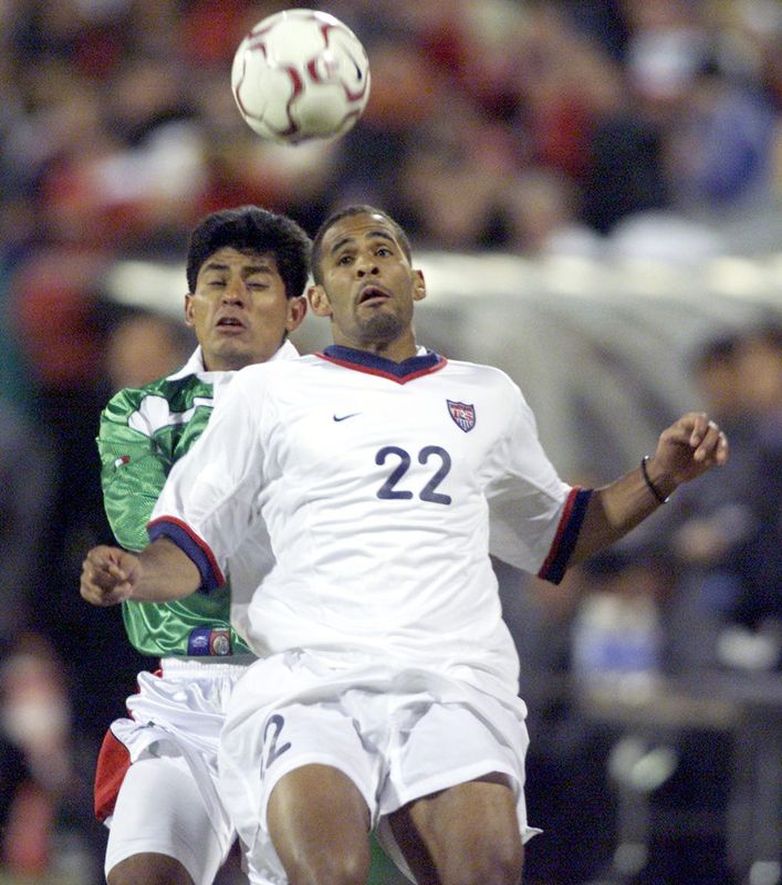 United States Tony Sanneh heads goes up for the ball against Mexico's Marco Ruiz during USA's famous 2-0 victory against Mexico on Feb. 28, 2001 at Crew Stadium.