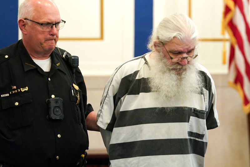 A sheriff's deputy leads Franklin Thompson into a Hamilton County courtroom on May 27.