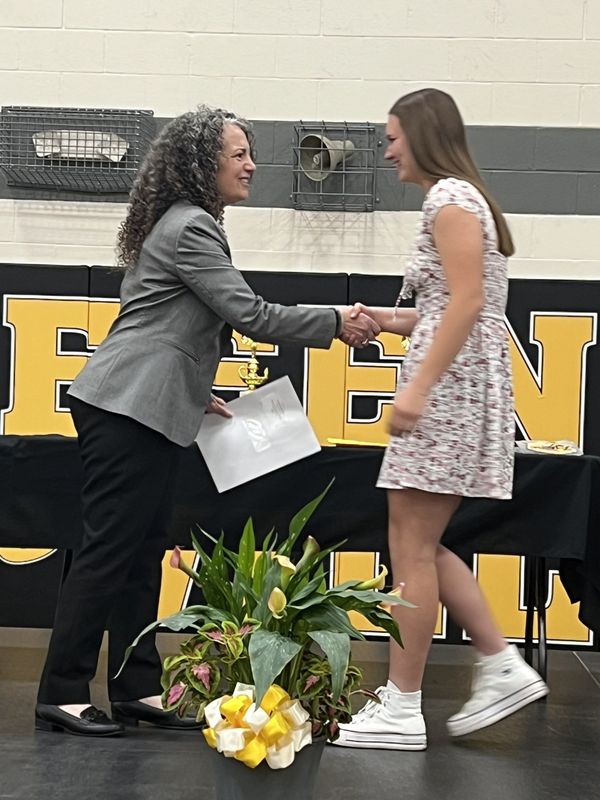 Riley Grace, a student at James A. Garfield High School, accepts the Casper Wenninger Scholarship for Veterinary Studies from Janice Simmons-Mortimer, executive director of the Portage Foundation. The foundation recently distributed $61,000 to Portage County students.