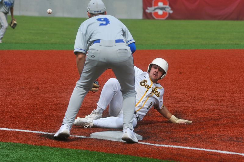 Colonel Crawford's Joe Zizzo slides into third trying to beat the throw to Wynford's Reed Johnson. The Eagles beat the Royals 6-5 in extras in a Division VI district semifinal at Shelby High School on May 27, 2026.