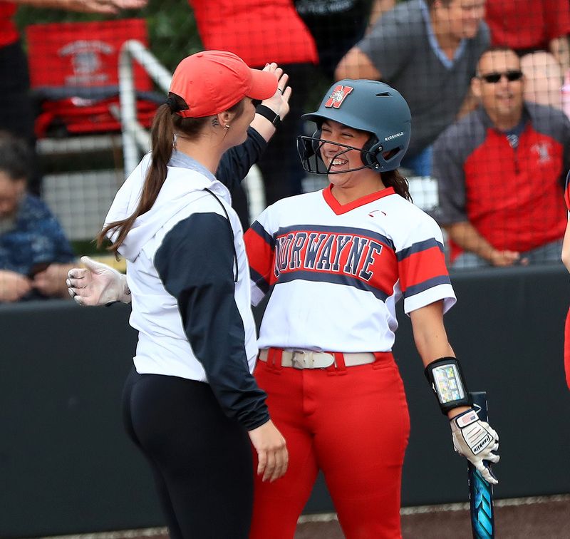 Norwayne's MaKenna Heyden all smiles with a Norwayne coach during Wednesday's Division V regional semifinal win over Tuslaw.