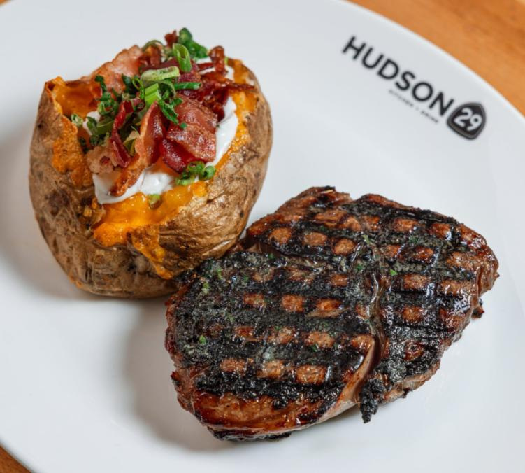 The ribeye and loaded baked potato at Hudson 29. The Cameron Mitchell restaurant, currently in Upper Arlington and New Albany, will open a third location in spring 2027 in Bexley.