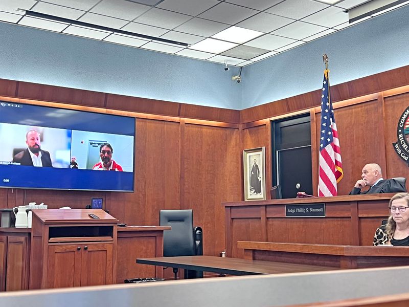 Bret Smith and his attorney Joseph Patituce appear remotely in front of Judge Phillip Naumoff on Thursday.