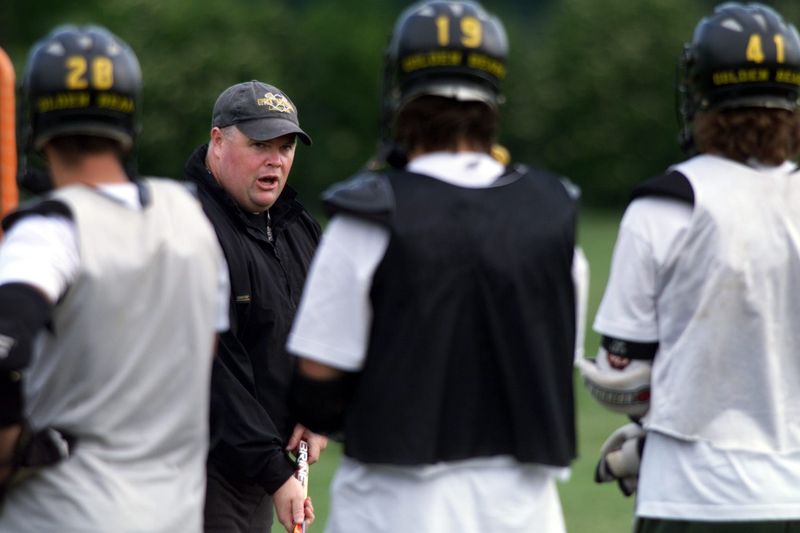 Upper Arlington boys lacrosse coach Ted Wolford talks to his players during practice in May 1999.