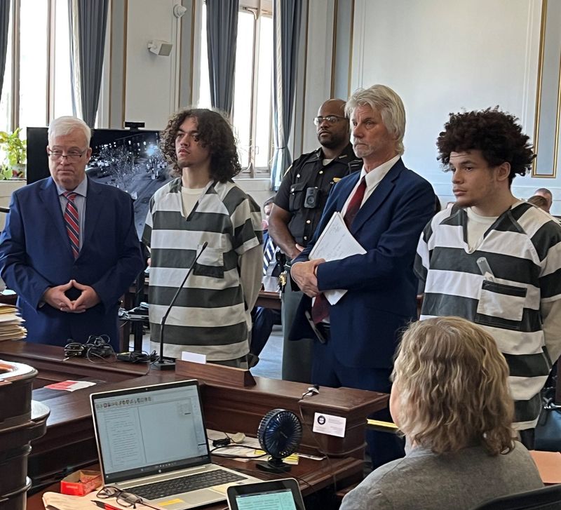 Deontae Conyers, at right, and Austin Smith, both wearing jail uniforms, at their sentencings in Hamilton County Common Pleas Court on May 28. Conyers' attorney, Kerry Neff, stands to his right. Smith's attorney, Richard Wendel II, is at far left.