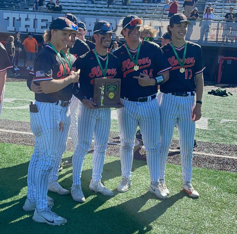 Hoover baseball seniors (left to right) Ryan Cervenak, Carter Lukens, Jack Andes, Jack Ziarko and Evan Fuller pose with the district championship trophy after a 3-2 win in eight innings vs. Green in the Division II final at Munson Stadium on Thursday, May 28, 2026.