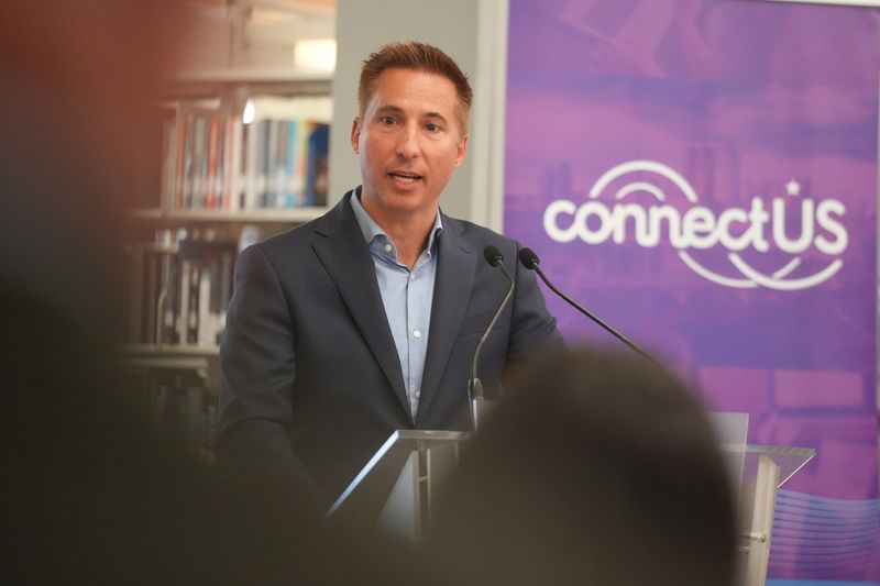 Jason Hall, former CEO of the Columbus Partnership, speaks at a May 28 event promoting ConnectUS and I Know I Can expanding computer access for Columbus Promise students. The event was held in the Columbus Hall library at Columbus State Community College.