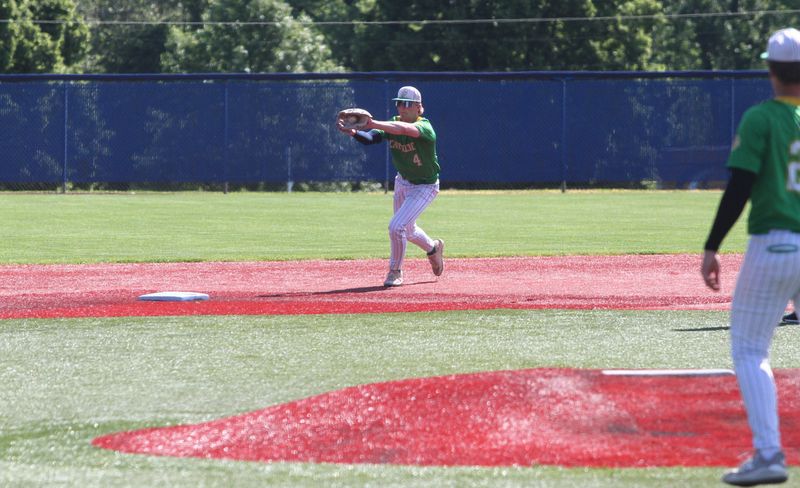 Newark Catholic's Kane Stephey fields a bouncer at second base during the Green Wave's 7-1 victory against Fairfield Christian to win a Division VII district championship at Beavers Field on May 29, 2026.