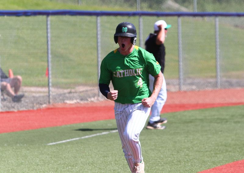 Newark Catholic's Kane Stephey celebrates scoring a run during the Green Wave's 7-1 victory against Fairfield Christian to win a Division VII district championship at Beavers Field on May 29, 2026.