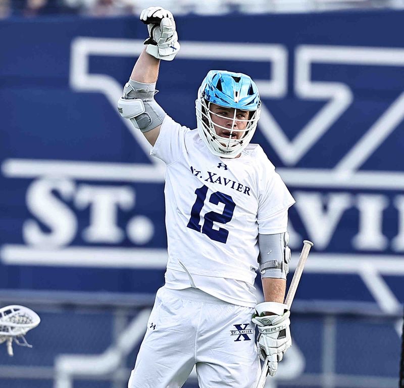 St. Xavier's Spencer Stegbauer (12) reacts after scoring in the OHSAA Region 4 boys lacrosse final on Friday, May 29, 2026.