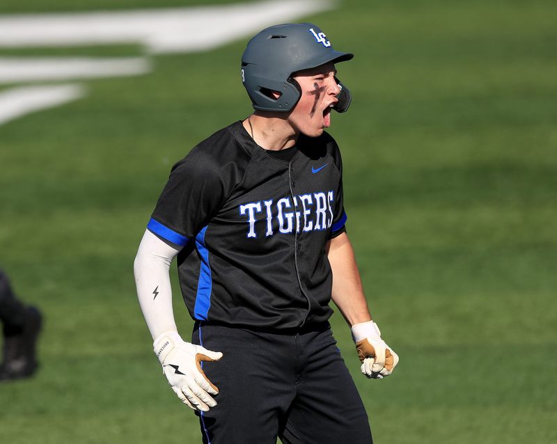 Lake Center Christian's Caleb Shelly reacts after hitting a triple against Grand Valley during their district final, Friday, May 29, 2026, at Thurman Munson Memorial Stadium.