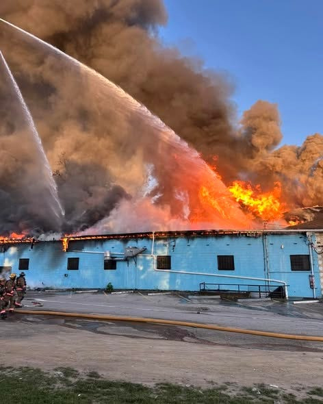 Akron firefighters work to extinguish a blaze at Roush’s Market at 554 W. Thornton St. on May 30, 2026.