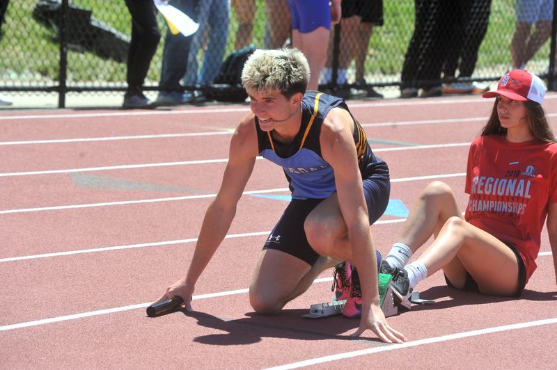 Hillsdale's Hayden McFadden lines up to run the opening leg of the 4x200 relay, the Falcons were fourth. Day 2 of the Division V regional track and field meet was hosted by Cuyahoga Heights on March 30, 2026.