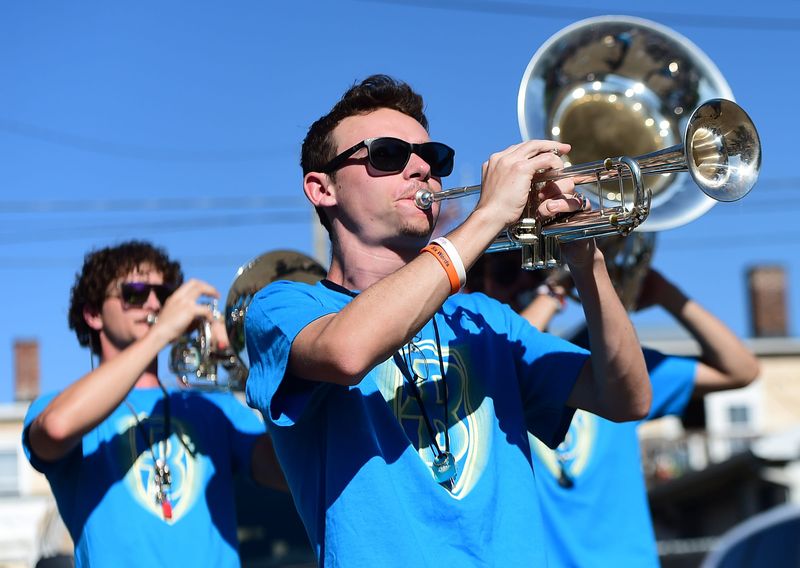 Will Pettry of the Canton Bluecoats Drum and Bugle Corps plays the trumpet Friday, May 29, 2026, during the opening Final Friday event at the Carnation Caboose in downtown Alliance.