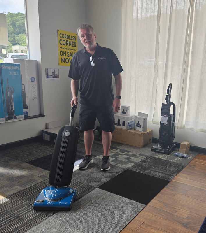 Brune Brenning with Scioto Valley Sweepers shows off a vacuum in the Chillicothe store.