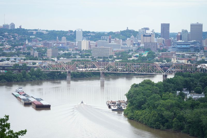 A barge carrying a crane for work on the Brent Spence Bridge is docked on the Kentucky side of the river in Ludlow.