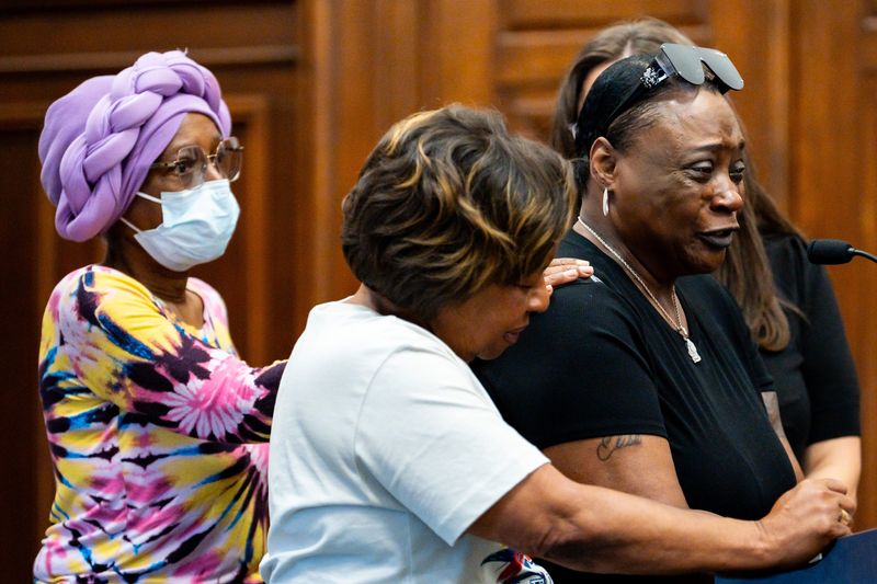 Yvette McIntyre, Ontario Bradley’s mother, right, is comforted by her sister April, middle, and another woman, during the sentencing hearing of Martinez Williams for the murder of her son, June 1, 2026, before Judge Tammy O’Brien in the Summit County Court of Common Pleas, in Akron, Ohio.