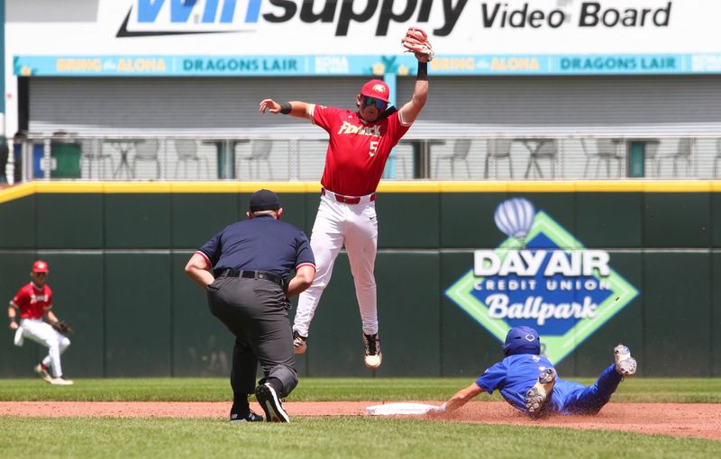Licking Valley's Brody Rodgers slides safely into second base as Bishop Fenwick's Jack Kauffman jumps for a high throw during the Panthers' 16-6 loss in a Division IV regional semifinal at Day Air Ballpark in Dayton on June 2, 2026.