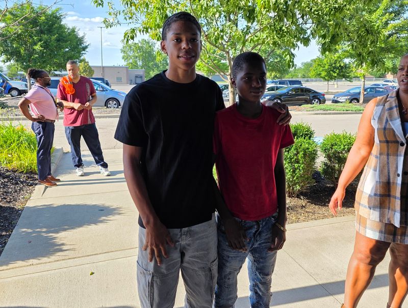 Ozyas Lloyd-Sloan of Sherwood Middle School, left, and Ja’Vawnte Richardson of Johnson Park Middle School, right, were among three students whose quick actions helped save a Columbus City Schools van driver after she experienced a medical emergency while driving them in May