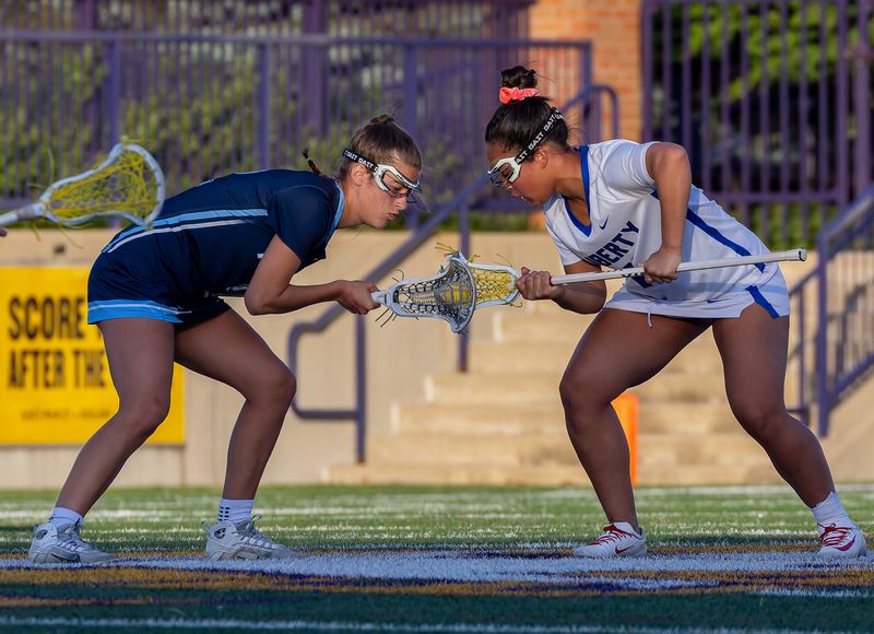 Hudson's Katie England, left, and Olentangy Liberty's Megan Benton take a draw during a Division I state semifinal June 2, 2026, in Ashland.