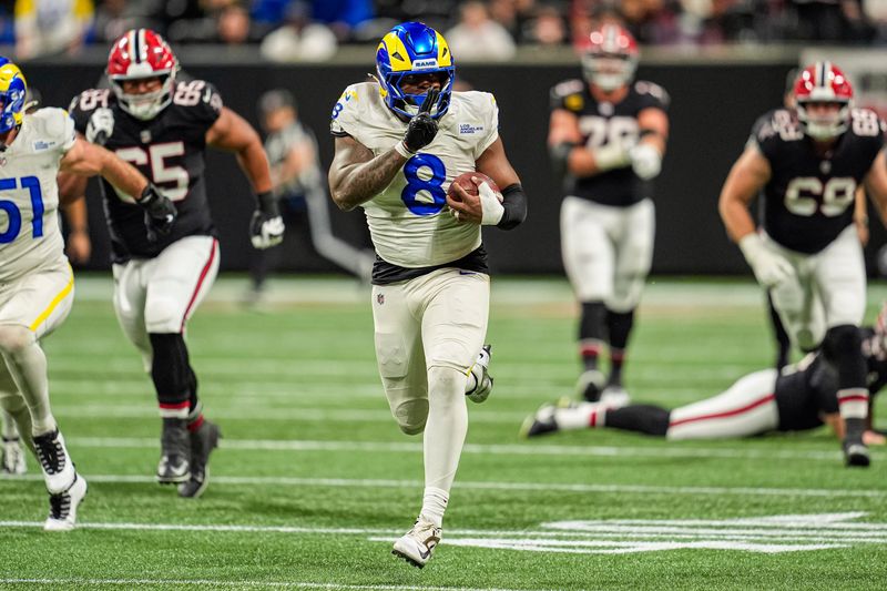 Dec 29, 2025; Atlanta, Georgia, USA; Los Angeles Rams linebacker Jared Verse (8) blocks a Atlanta Falcons field goal and returns it for a touchdown during the second half at Mercedes-Benz Stadium. Mandatory Credit: Dale Zanine-Imagn Images