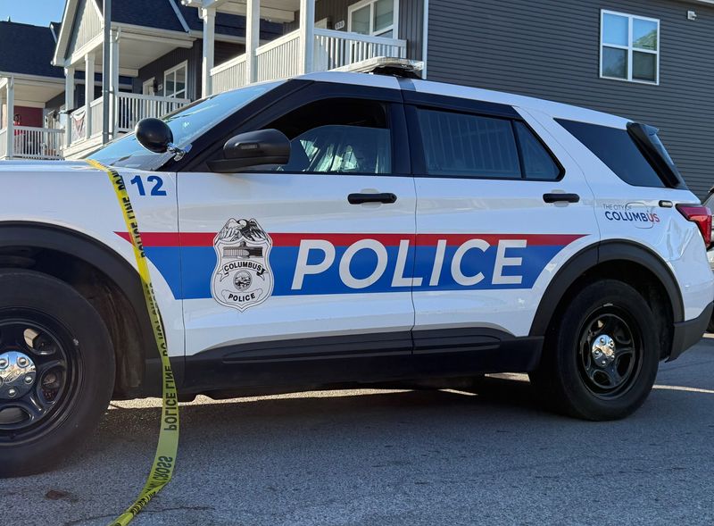 A Columbus Division of Police cruiser sits on the 800 block of Wilson Avenue on June 3, 2026, the morning after officers shot and killed a man while responding to a domestic violence call.