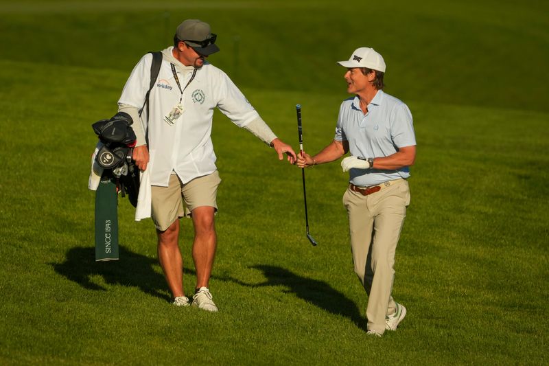 Actor Rob Lowe walks the first fairway at Muirfield Village Golf Club.